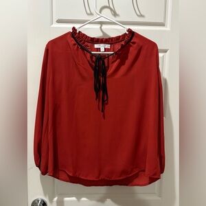 Elegant Red Blouse with Black Trim